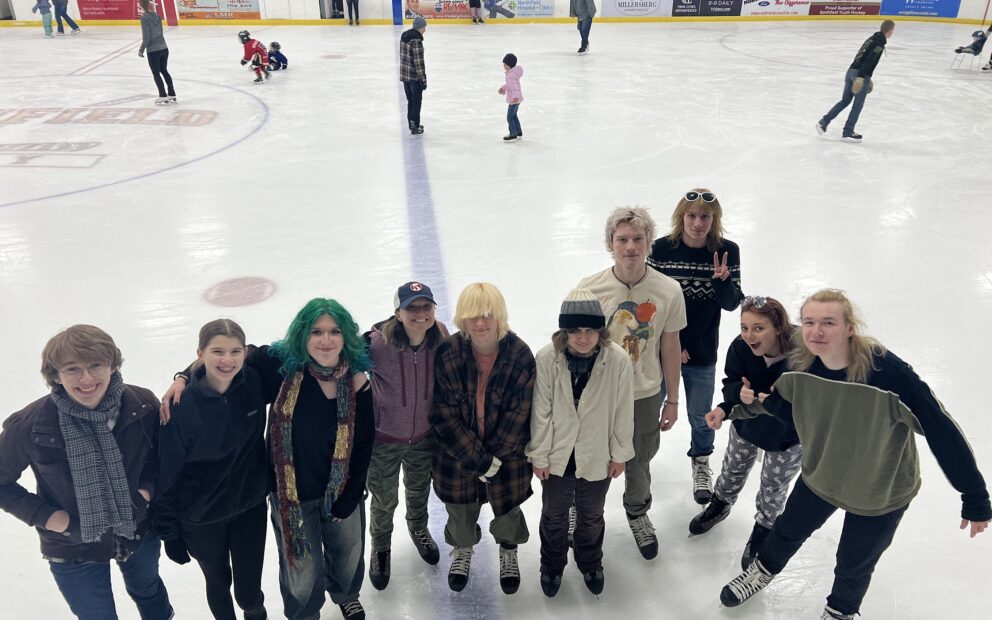 A group of youth at an ice rink